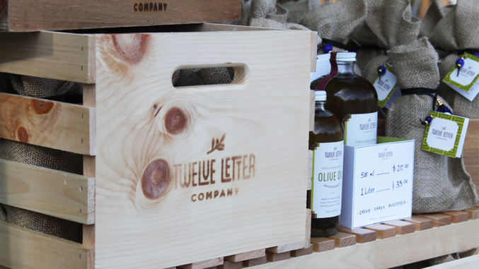 Gourmet food farmers market stand design detail for Twelve Letter Olive Oil Company