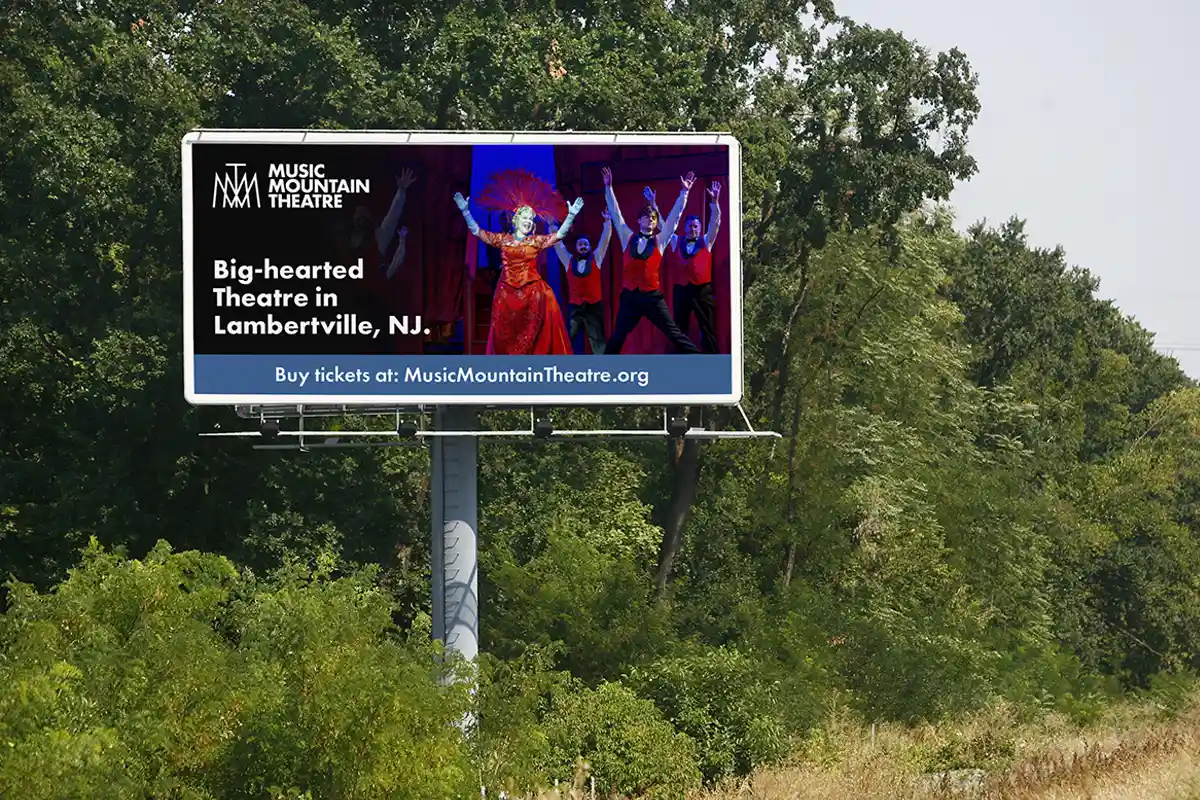 A mockup of a roadside billboard advertisement for Music Mountain Theatre.