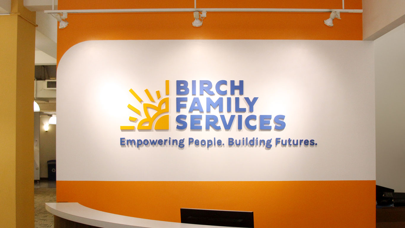 Birch Family Services reception wall logo