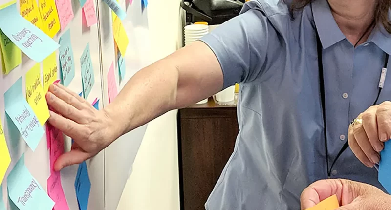 A photo of a person participating in a branding workshop.