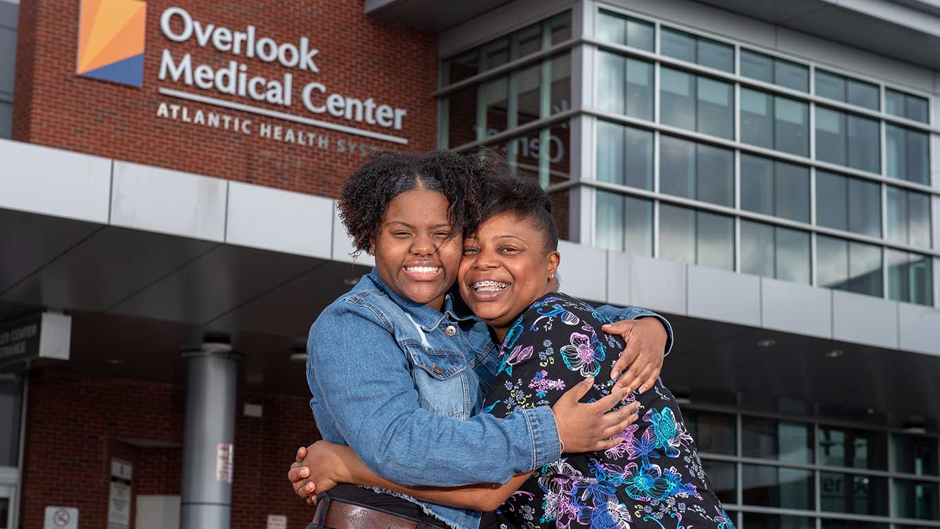 Two women hugging outside of Overlook Medical Center