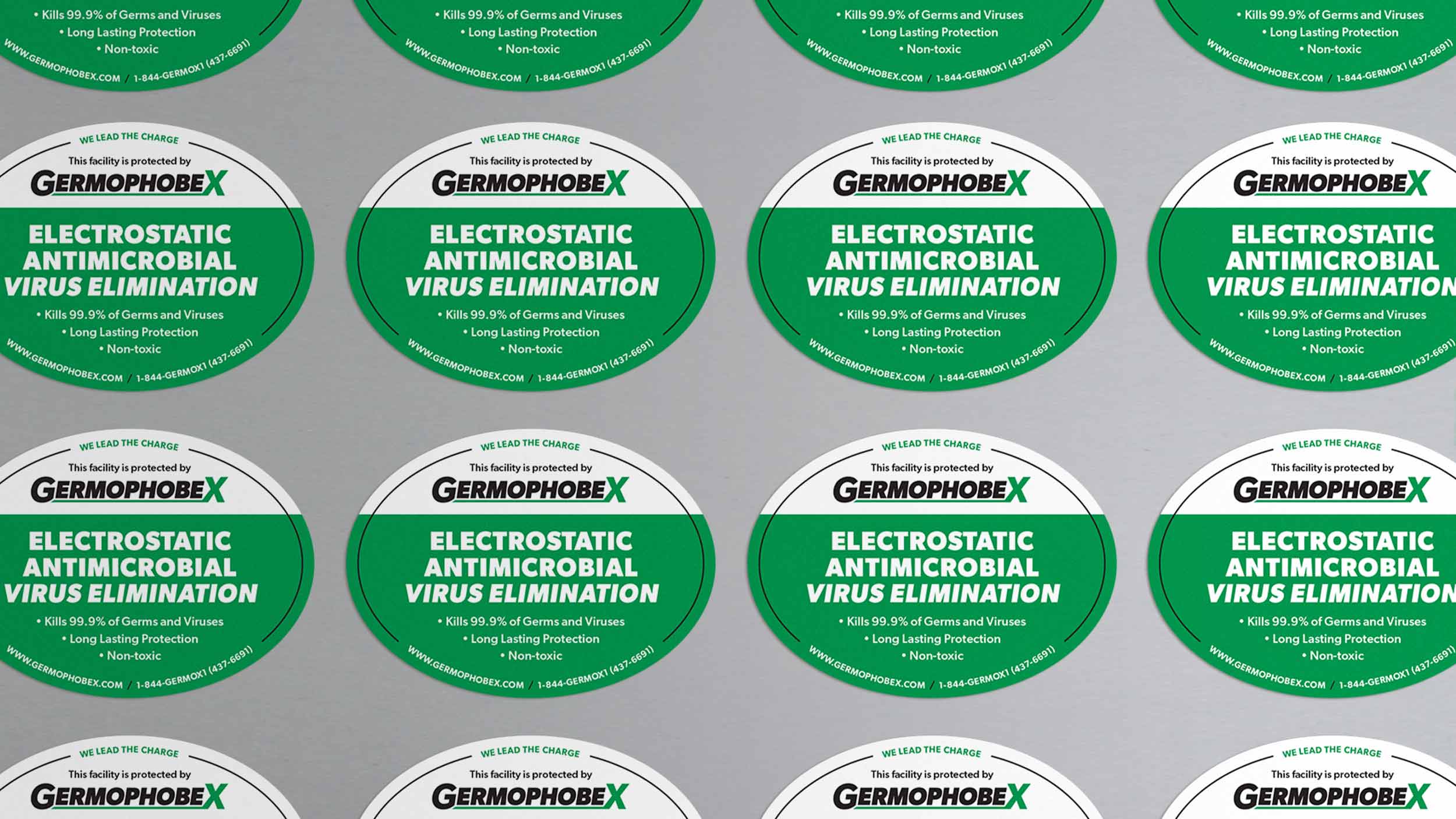 A grid of green and white stickers that read "Electrostatic antimicrobial virus elimination"