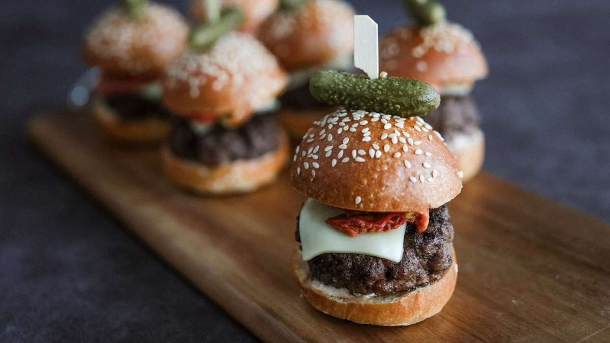 Mini burger sliders served at Citi Field on a wooden plank. Photo by Christina Zen.