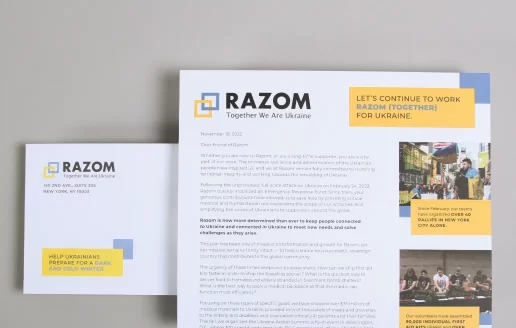 An EOY fundraiser mailer for Razom showcasing a letter and envelope.