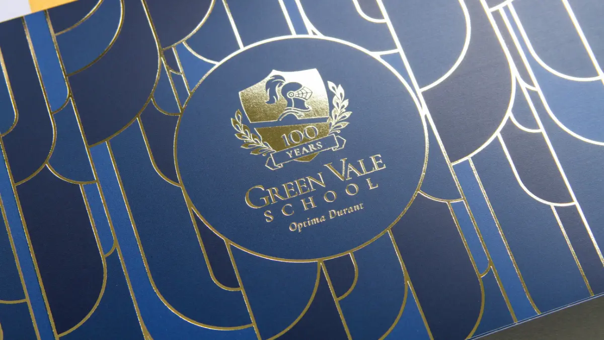 A close up of the Green Vale School invitation for their centennial anniversary event called Party of the Century.