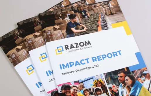 Stack of Razom Impact Report booklets