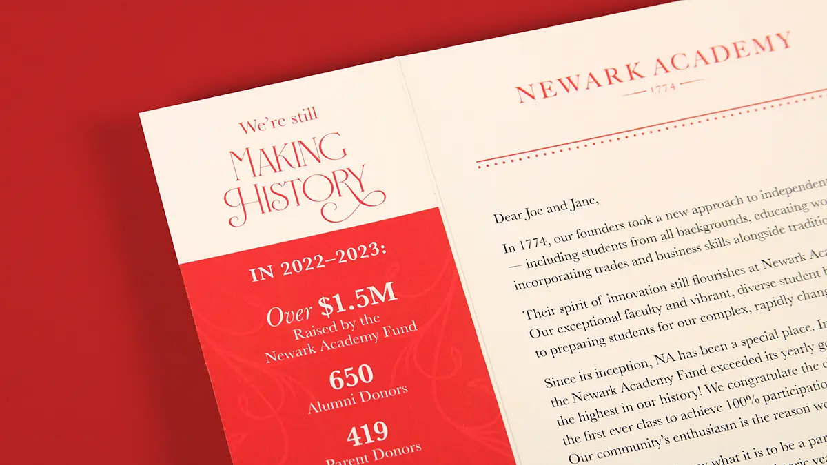 A close up of a trifold brochure showing statistics for the last year's fundraiser.