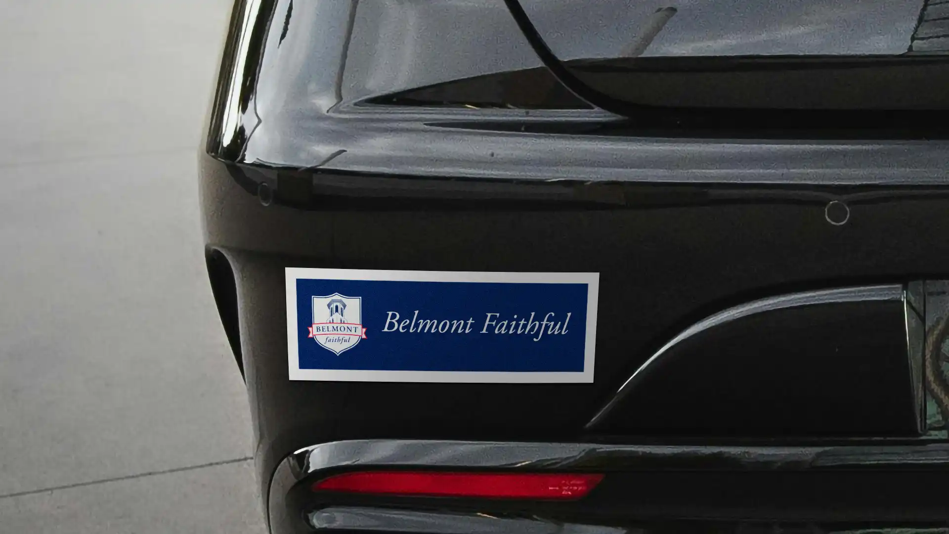 Bumper sticker on the back of a car reading "Belmont Faithful" with the Belmont University alumni fundraising campaign logo.