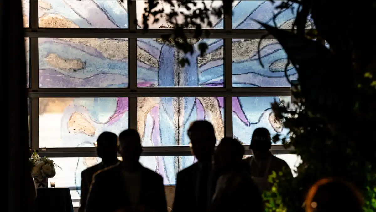 Guests at the Gala standing in front of vinyl window graphics.