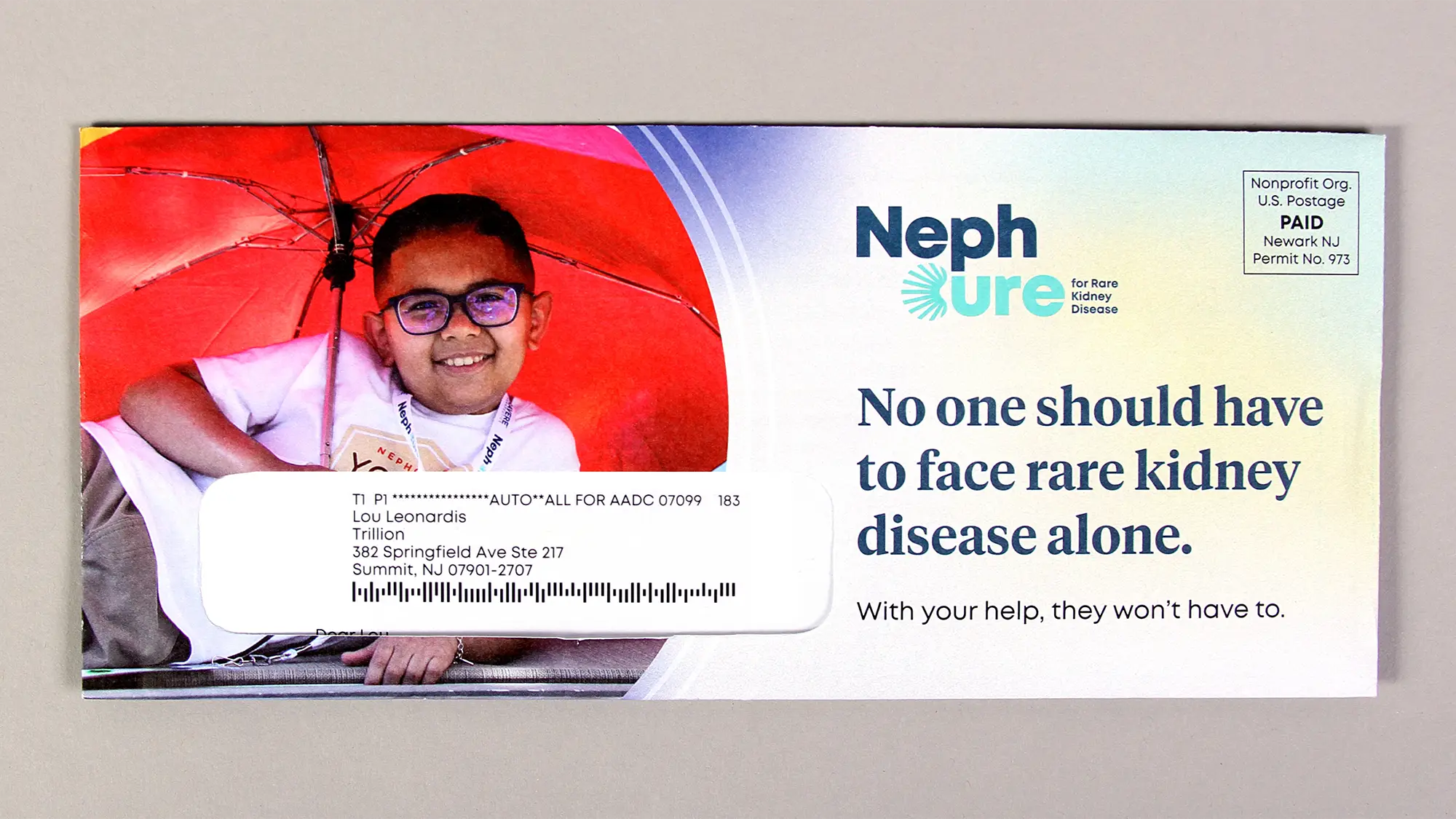 The outer envelope for the NephCure end of year appeal mailing, featuring an image of a patient and a headline with a gradient background.