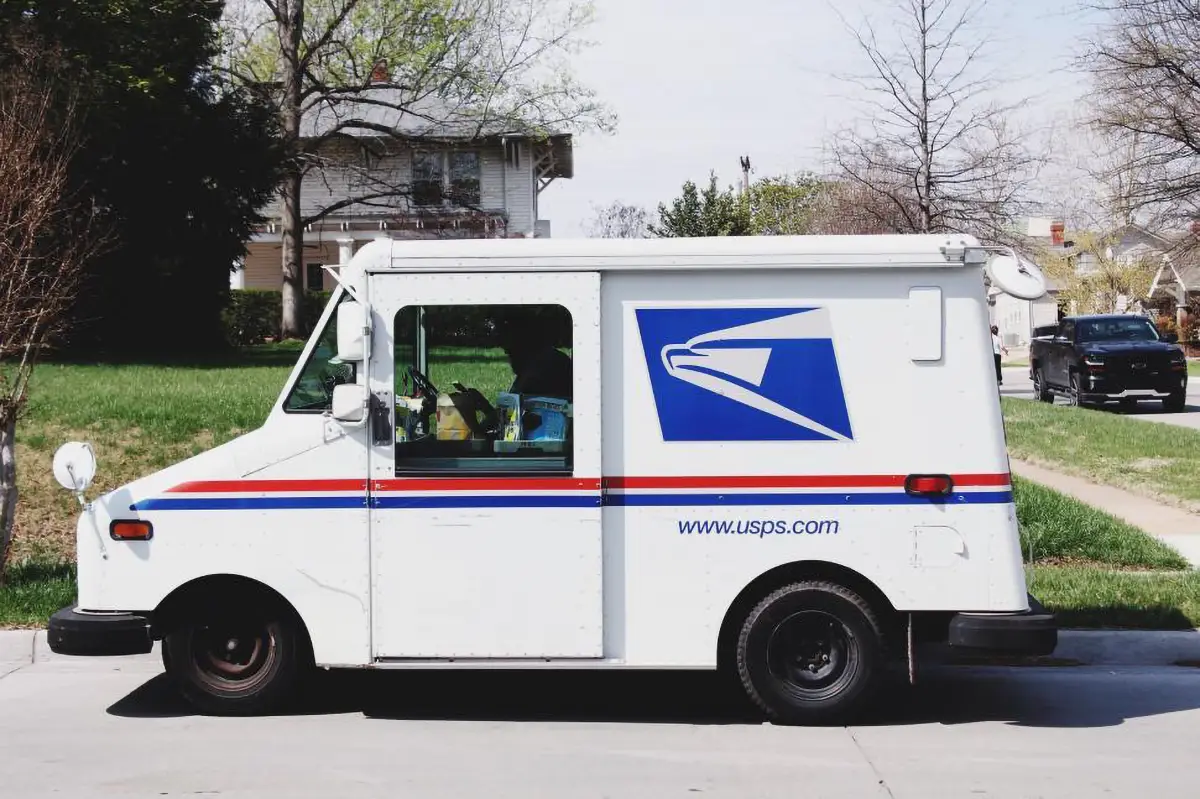 A photo of a USPS mail truck.