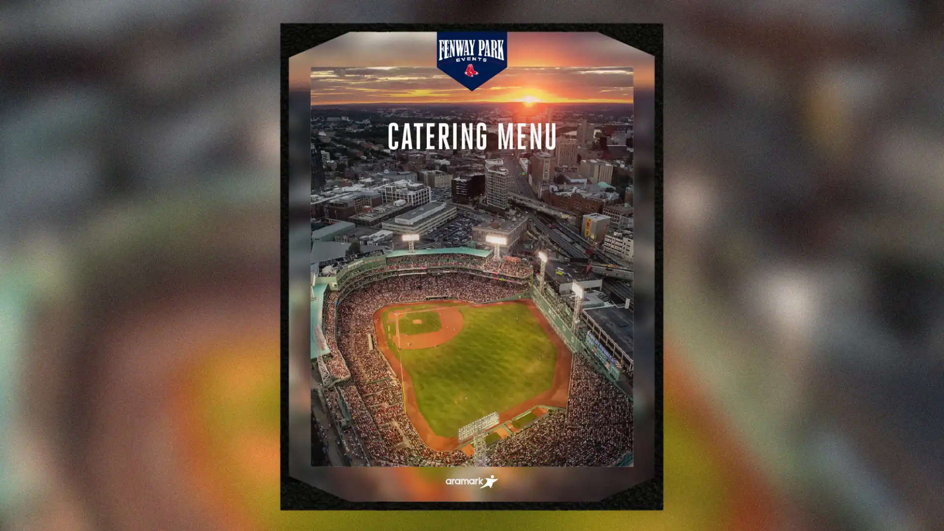 The front cover of the menu for Fenway Park on a blurry background.