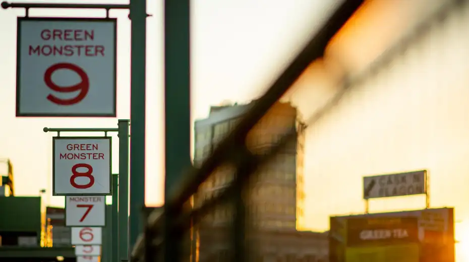 A photo of the Green Monster signs at Fenway Park.